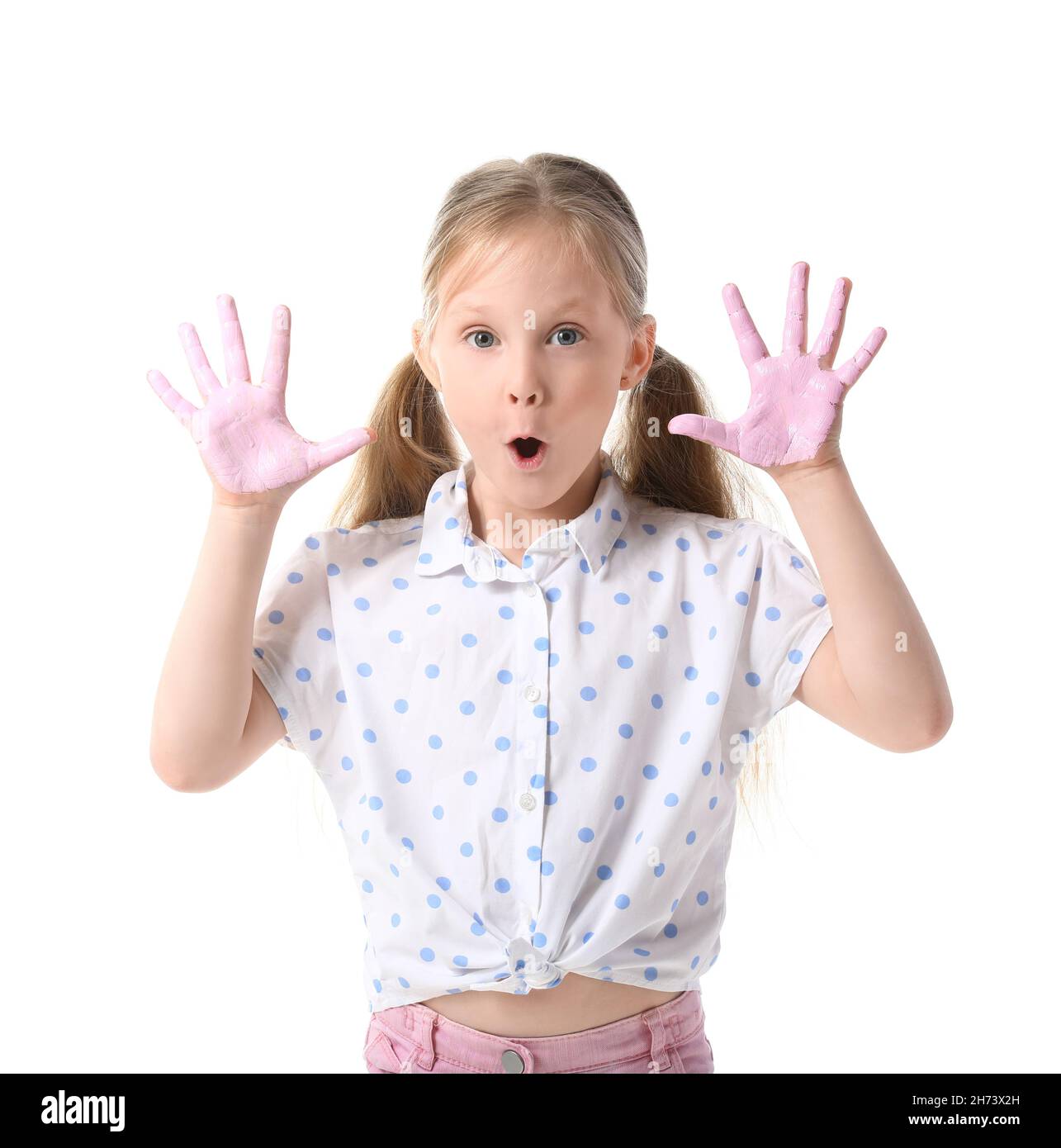 Surprised little girl with hands in paint on white background Stock ...