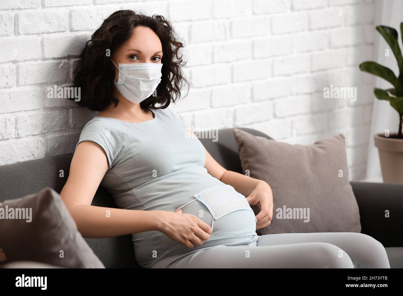 Young pregnant woman with medical masks at home Stock Photo Alamy