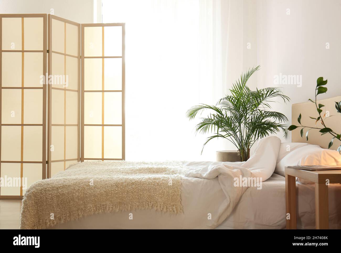 Stylish folding screen in bedroom interior Stock Photo Alamy