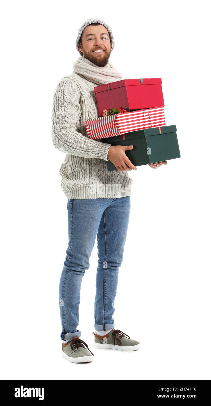 Handsome man with Christmas gifts on white background Stock Photo