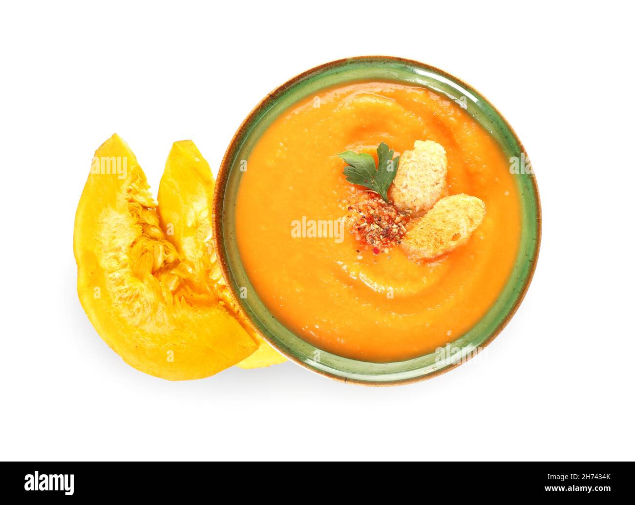 Bowl with delicious pumpkin cream soup on white background Stock Photo ...