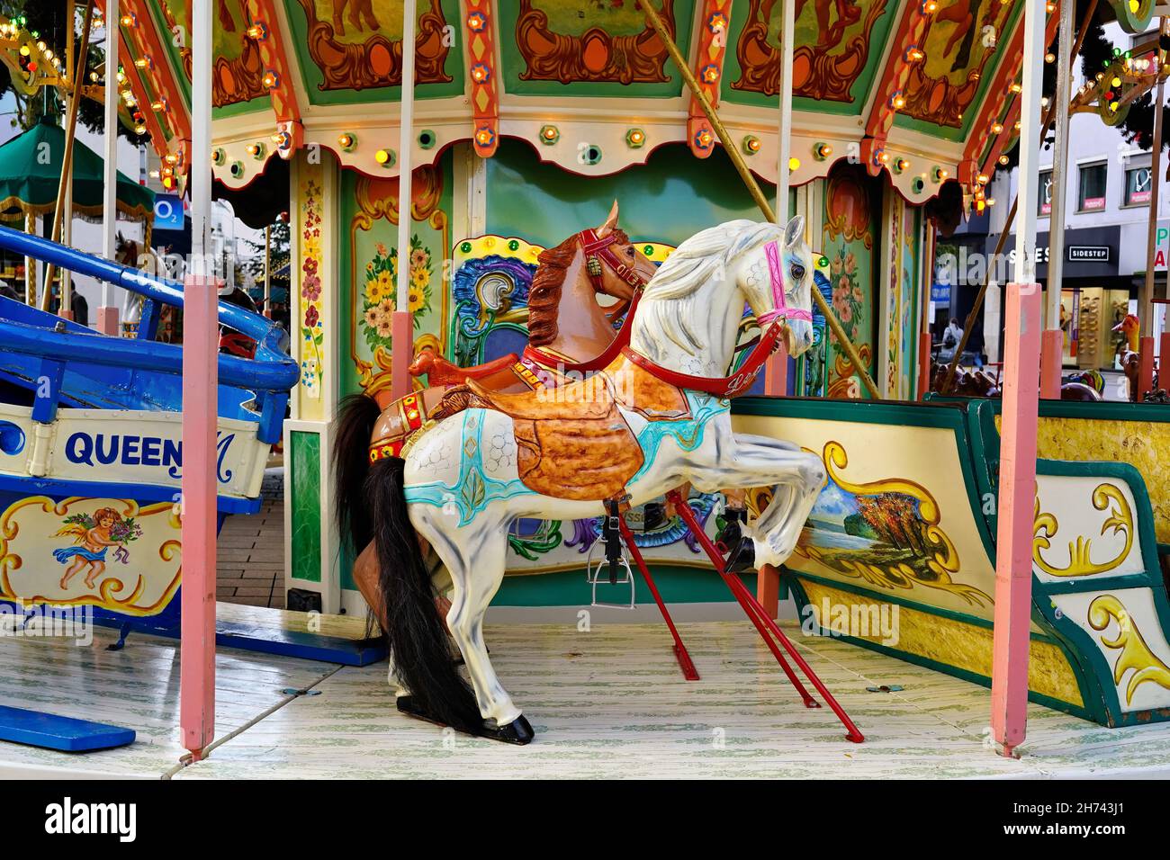 Nostalgic horse carousel at the Christmas market 2021 in Düsseldorf/Germany. Stock Photo