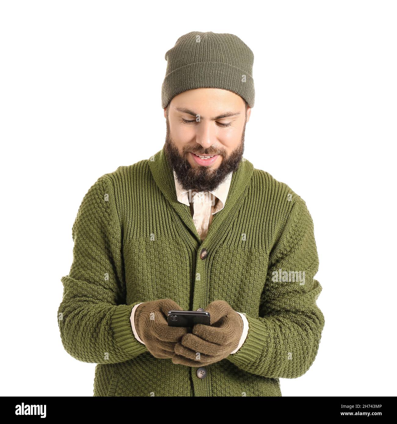 Handsome man in winter clothes and with phone isolated on white Stock ...