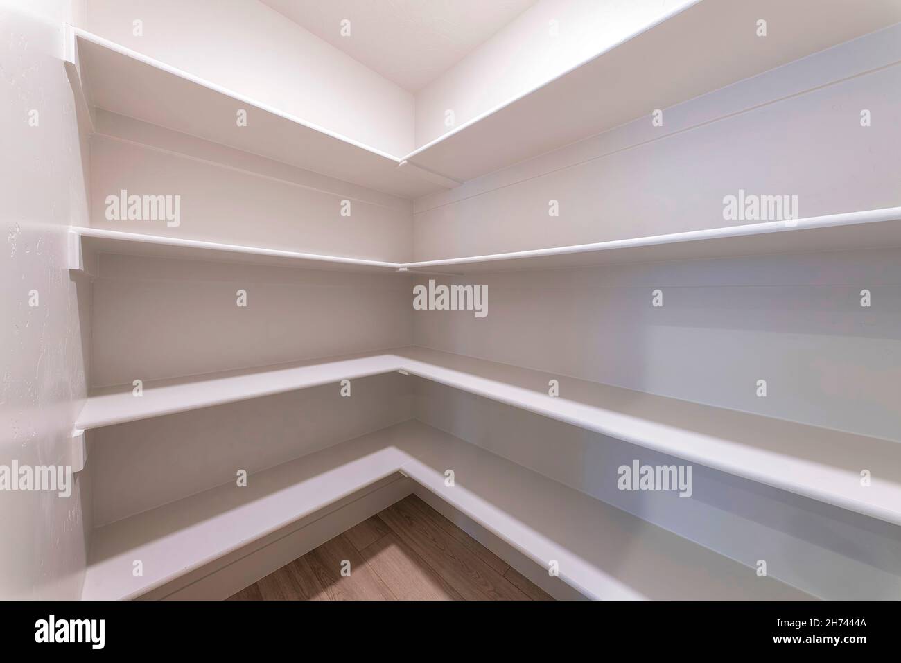 Empty kitchen pantry interior with white shelving units Stock Photo Alamy