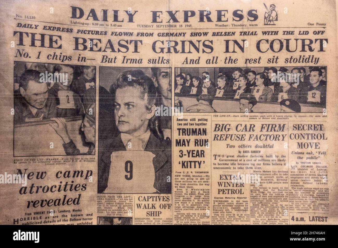 'The Beast Grins in Court' front page headline at the trial of guards from Bergen Belsen camp, Daily Express, 18th September 1945. Stock Photo