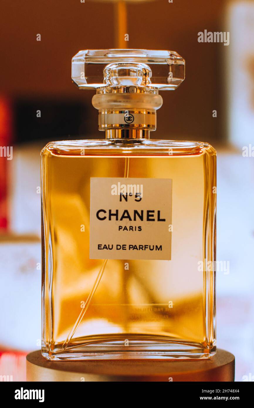 Display of golden bottle Chanel No. 5 perfume by French luxury brand Chanel. Famous fragrance. Stock Photo