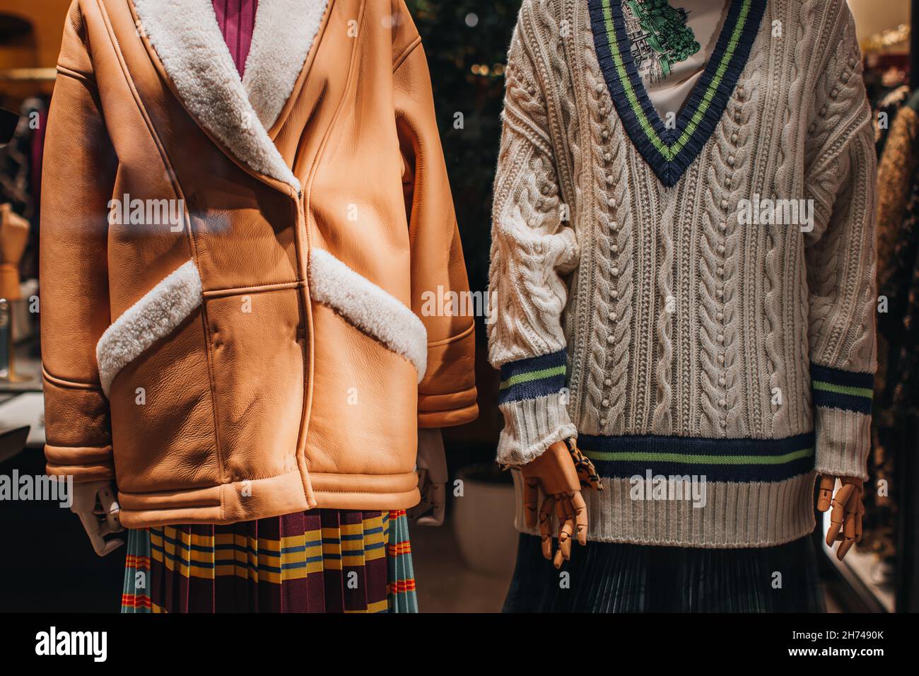 Mannequins dressed in a stylish fashionable winter collection. Knit Sweater and Brown Fur Coat. Fashion details Stock Photo