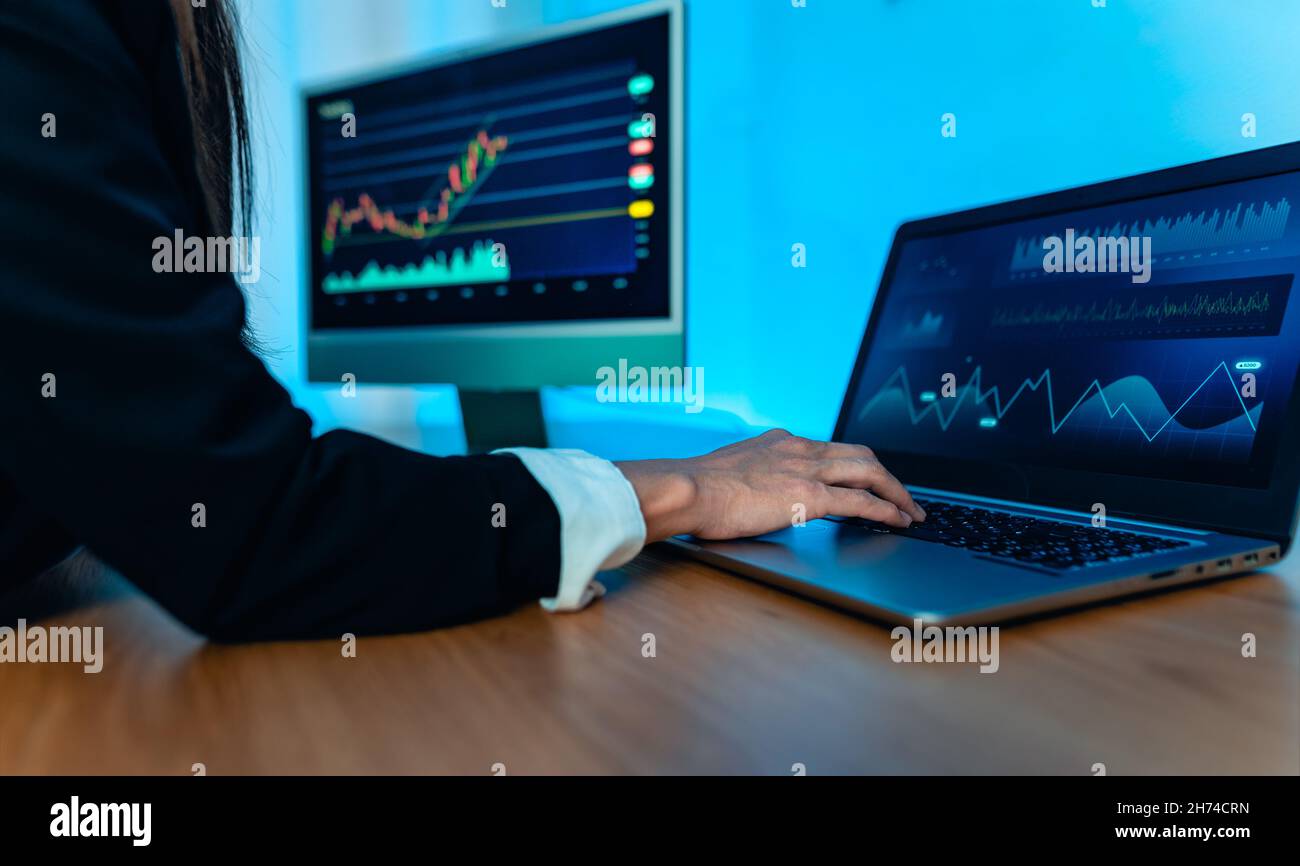 Business trader woman working on crypto currency markets with blockchain technology - Decentralized finance and stock exchange concept Stock Photo