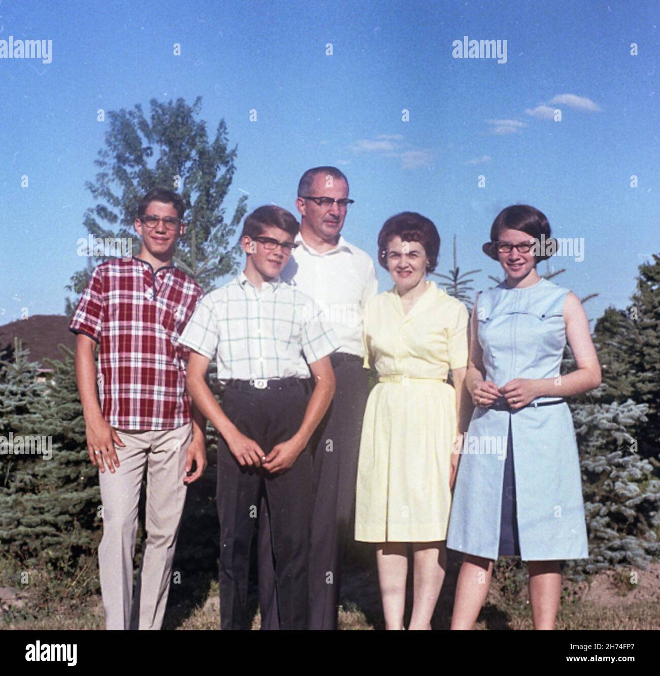 1966 casual family poses for a photo, USA Stock Photo