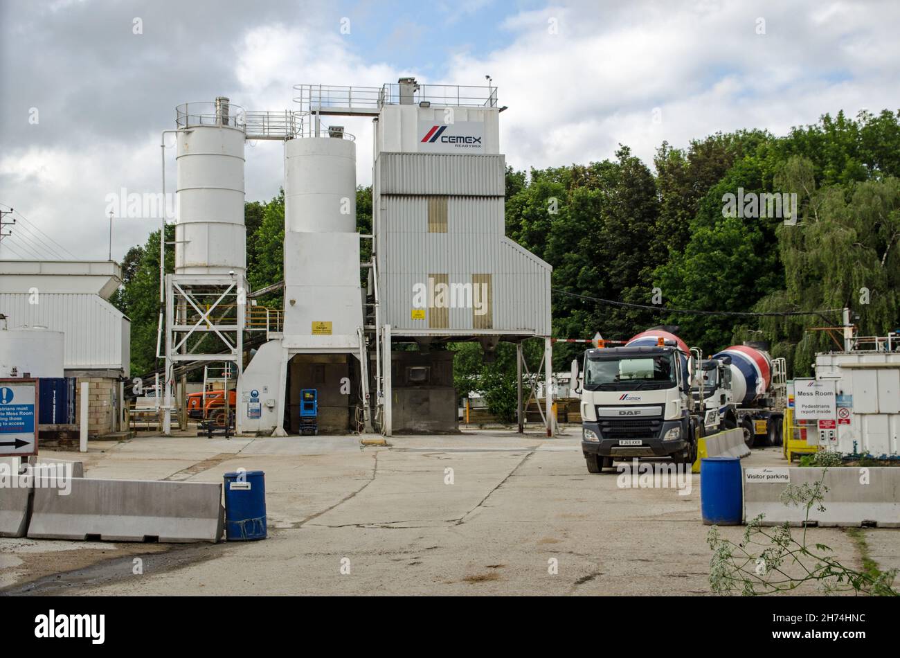 Basingstoke, UK - July 3, 2021:  View of the hoppers and lorries at the Cemex building material plant in Basingstoke, Hampshire.  The site provides ce Stock Photo