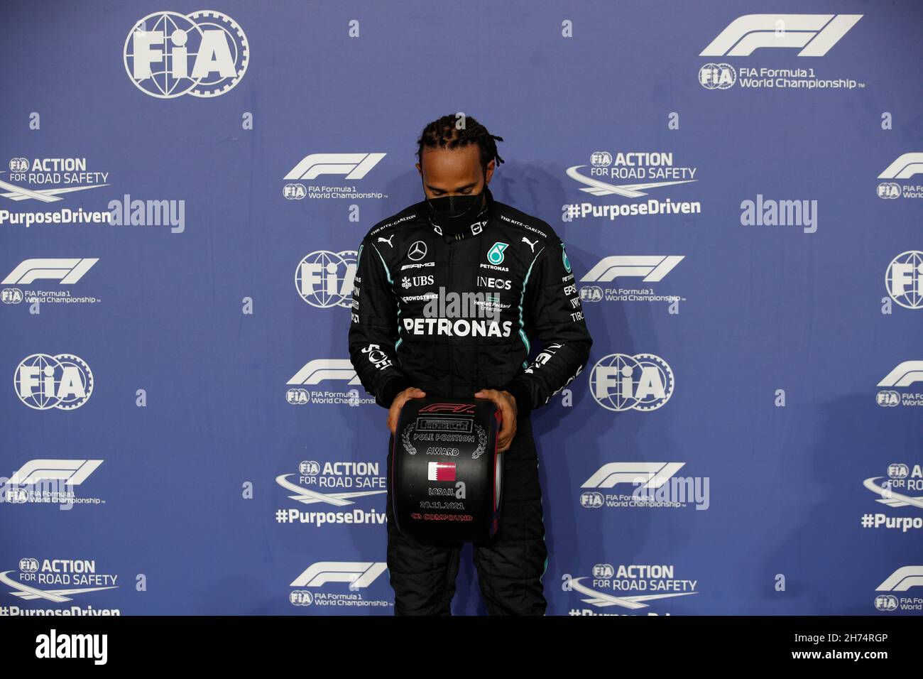 Formula One F1 Qatar Grand Prix Losail International Circuit Lusail Qatar November 21 Mercedes Lewis Hamilton Celebrates With The Trophy On The Podium After Finishing First Place In