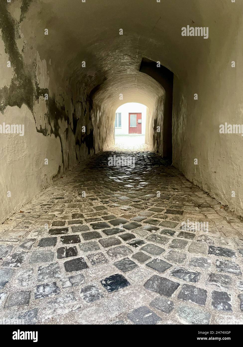 Narrow dark passage in the old town of medieval Feldkirch. Vorarlberg, Austria. Stock Photo