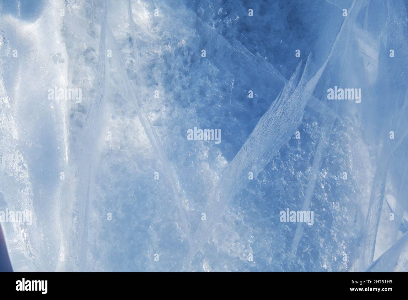 Texture of winter ice surface. Blue natural ice background. Stock Photo