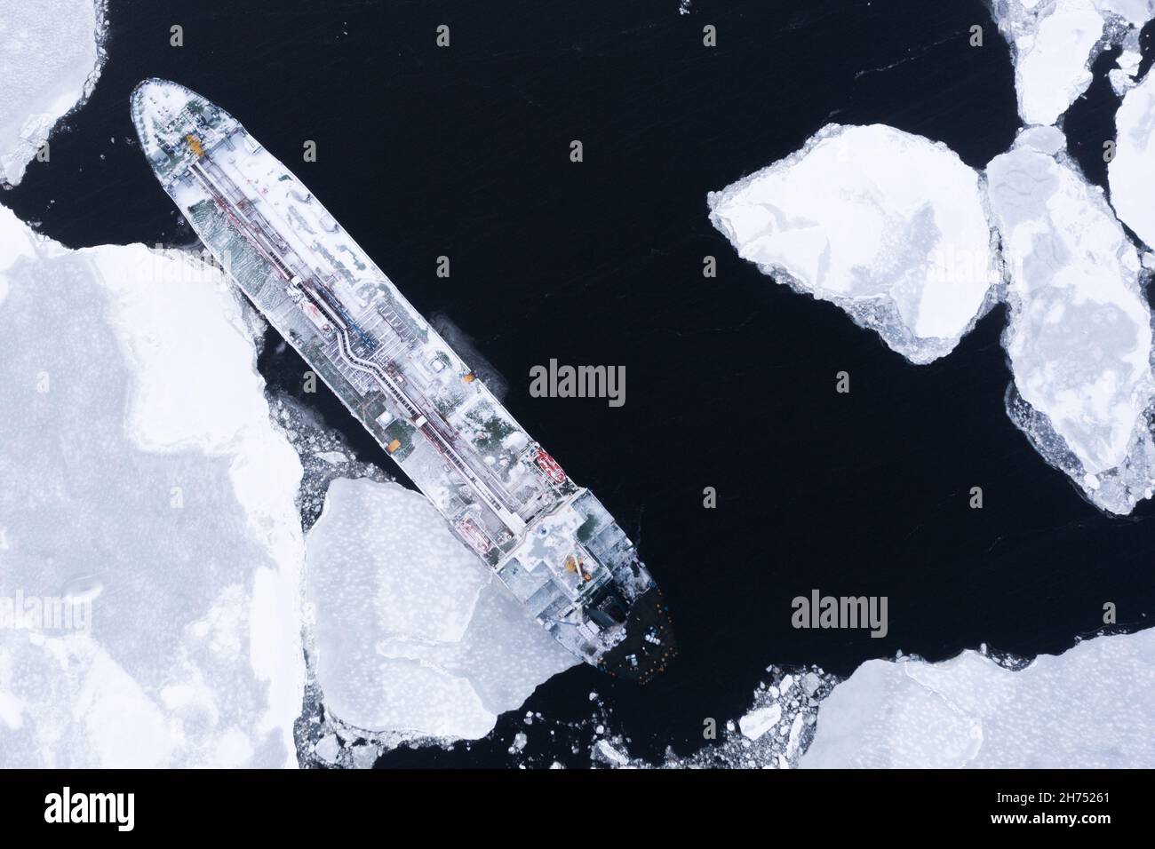 The ship is in the sea among the ice. Stock Photo