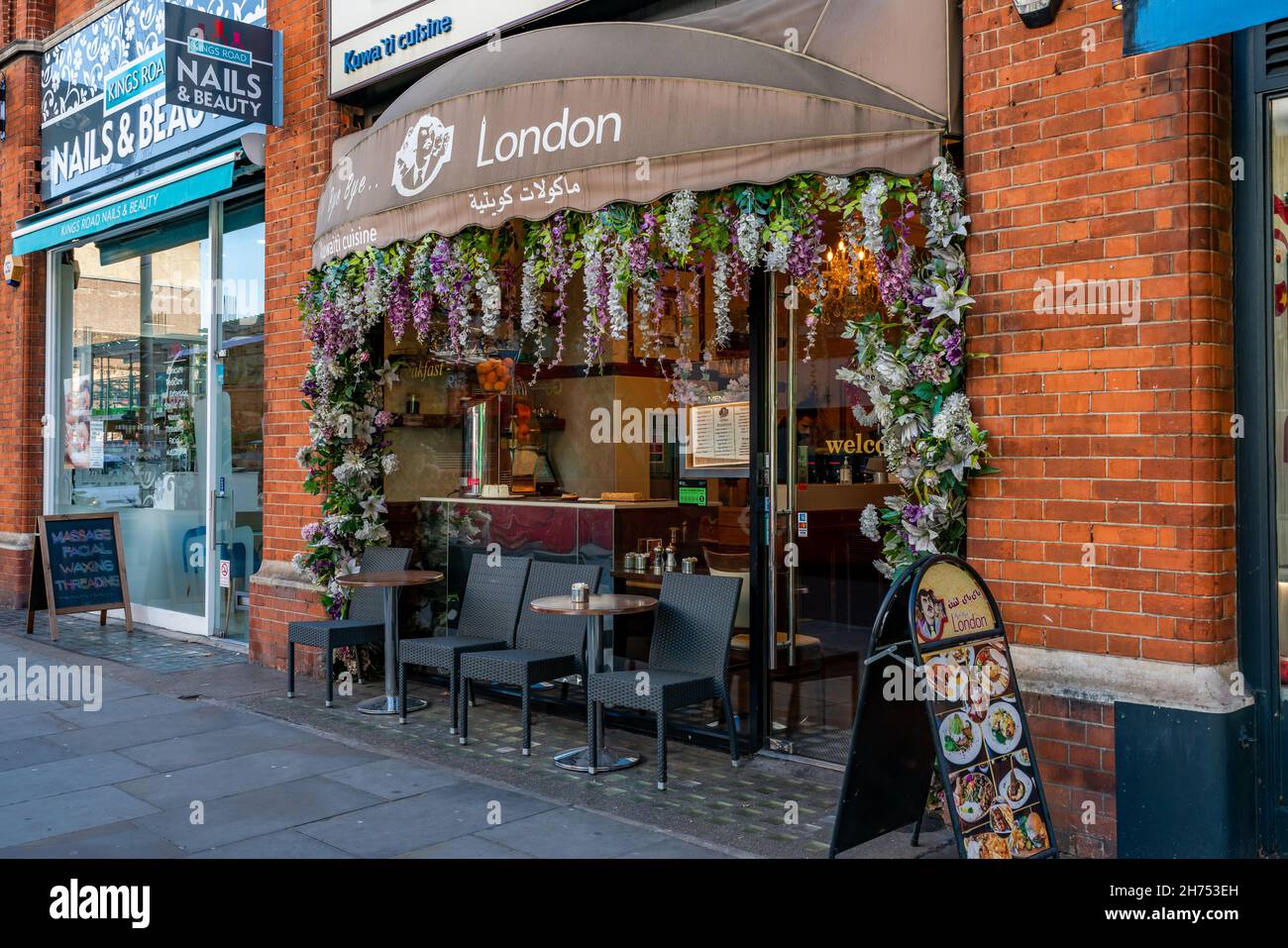 LONDON, UK - NOVEMBER 11, 2021: Bye Bye London restaurant on busy King's Road in Chelsea offers variety of predominantly organic Middle Eastern dishes Stock Photo