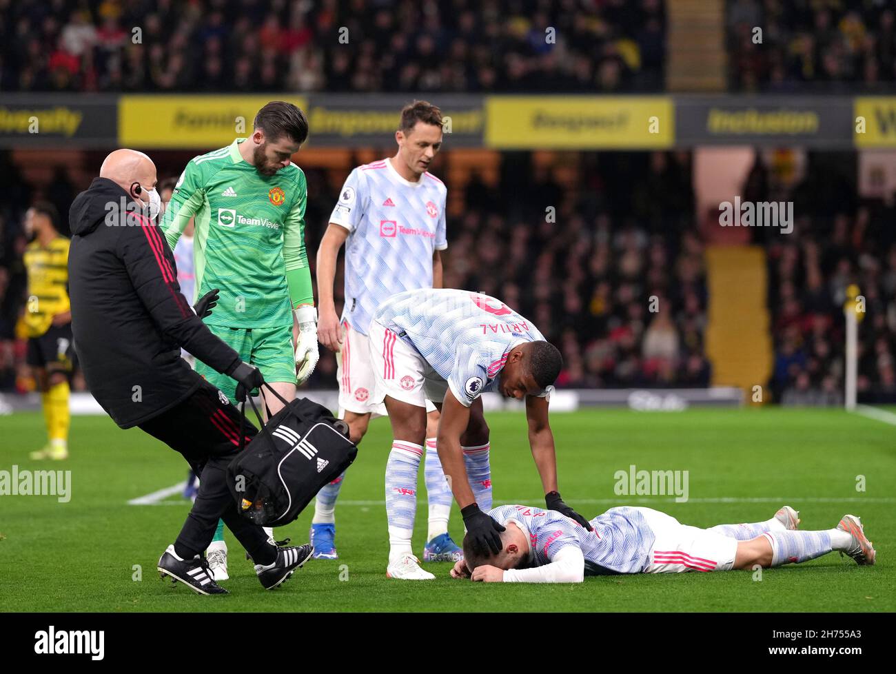 Manchester United's Luke Shaw appears injured during the Premier League match at Vicarage Road, Watford. Picture date: Saturday November 20, 2021. Stock Photo