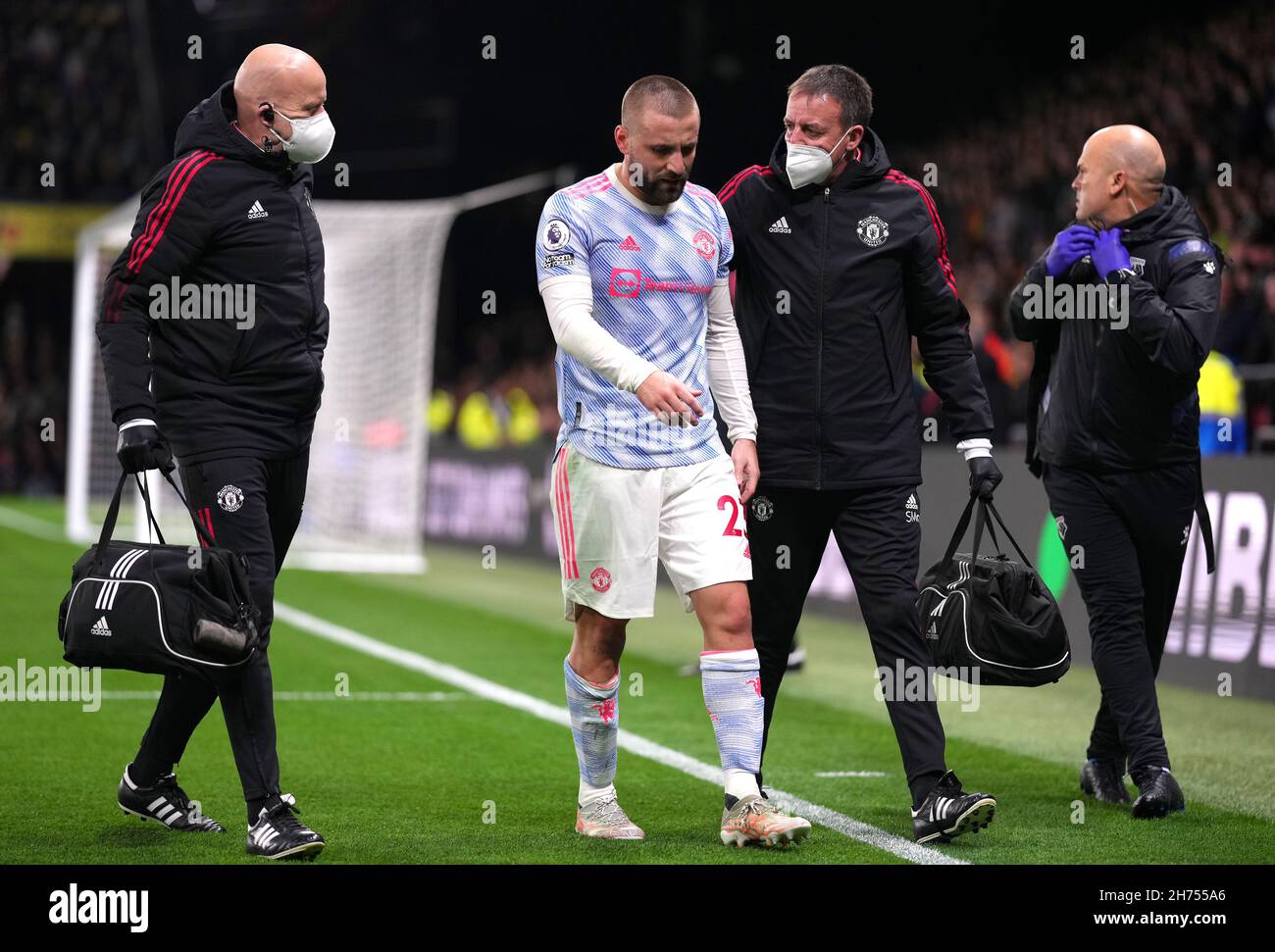 Manchester United's Luke Shaw walks off the pitch after an injury during the Premier League match at Vicarage Road, Watford. Picture date: Saturday November 20, 2021. Stock Photo
