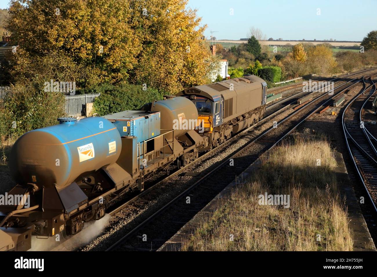 DRS class 66 loco 66426 leaves Barnetby station with the 0851 Wrenthorpe to Grimsby Town Rail Head Treatment Train service on 17/11/21. Stock Photo