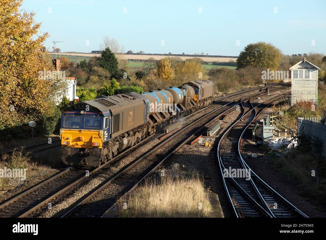 DRS class 66 locos 66426 and 66423 leave Barnetby station with the 0851 Wrenthorpe to Grimsby Town Rail Head Treatment Train service on 17/11/21. Stock Photo