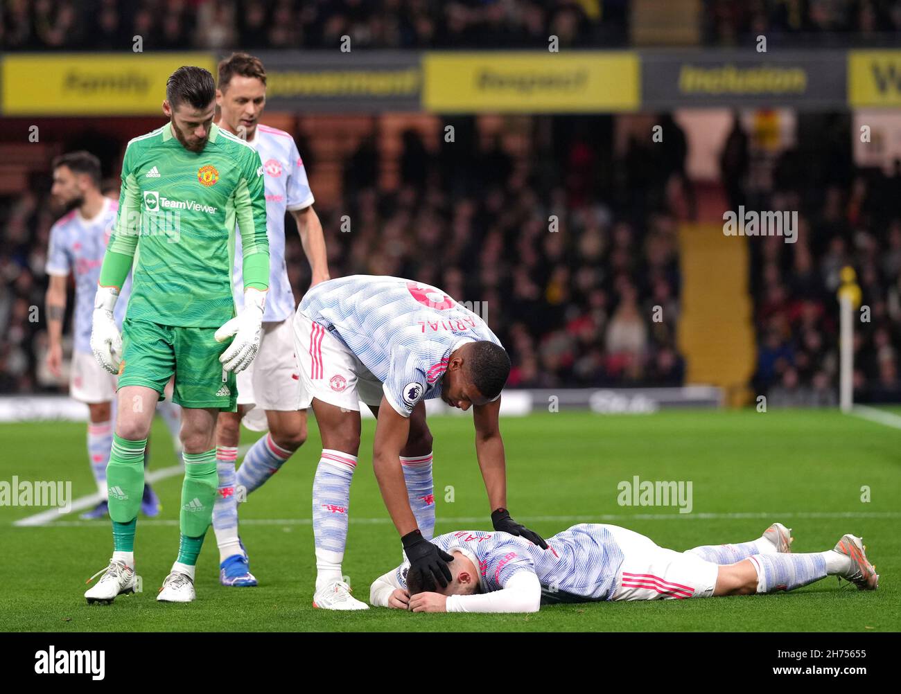 Manchester United's Luke Shaw appears injured during the Premier League match at Vicarage Road, Watford. Picture date: Saturday November 20, 2021. Stock Photo