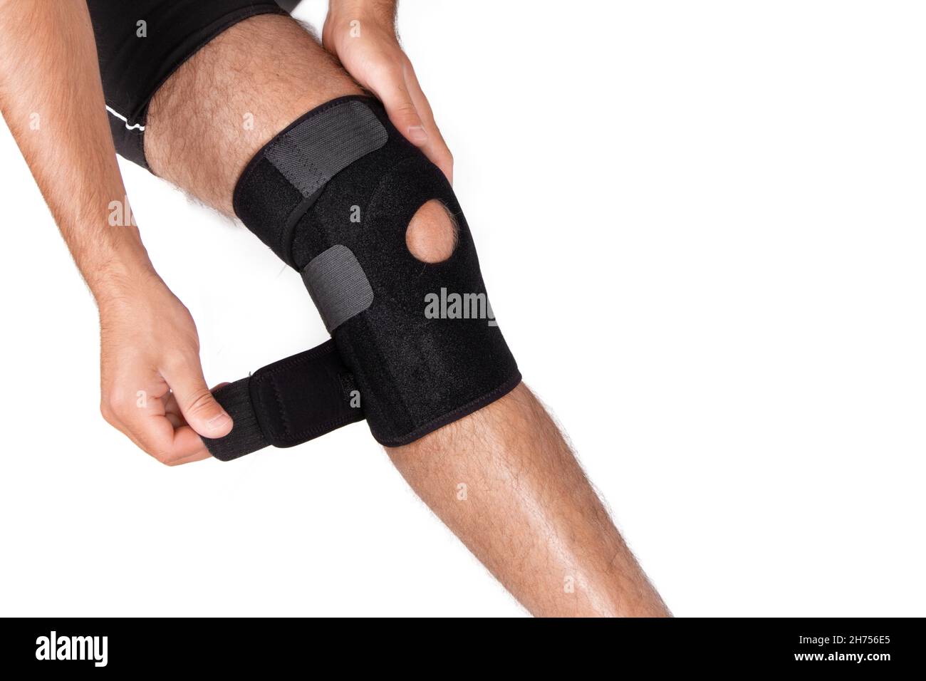 Knee Support Brace on leg isolated on white background. Orthopedic  Anatomic. Braces for knee fixation, injuries and pain. Knee Joint Bandage  Sleeve Stock Photo - Alamy