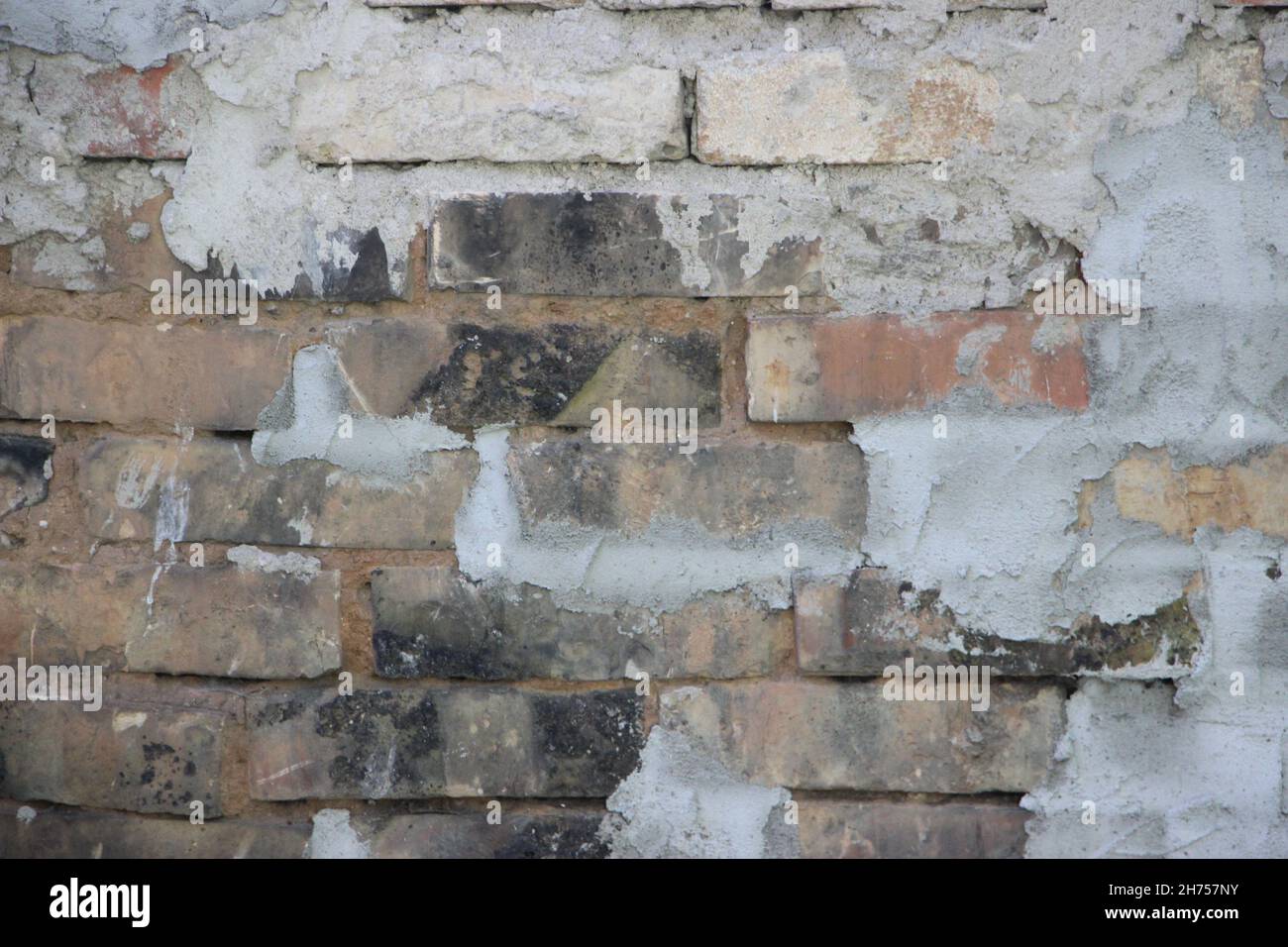 old vintage dirty brick wall with peeling plaster, texture background ...