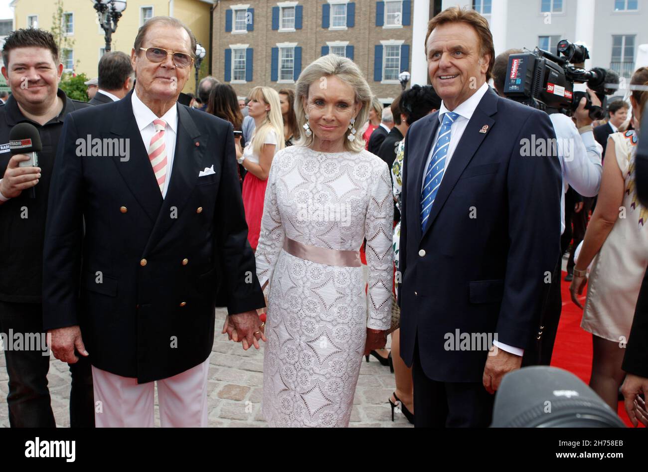 Rust, Germany - July 12, 2012: Hotel Bell Rock Opening at Europa-Park in Rust with British Actor Sir Roger Moore, wife Kristina Tholstrup and Europa-Park CEO Roland Mack. Europa, Park. Mandoga Media Stock Photo
