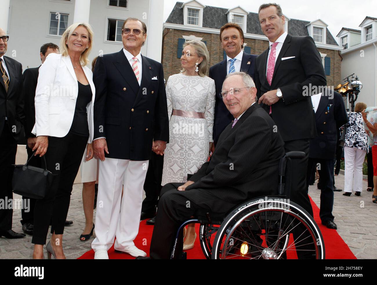 Rust, Deutschland. 12th July, 2012. Rust, Germany - July 12, 2012: Hotel Bell Rock Opening at Europa-Park in Rust with german TV Host Sabine Christiansen, Bristish Actor Sir Roger Moore, wife Kristina Tholstrup, Europa-Park CEO Roland Mack, german Boxer Henry Maske and german Finance Minis Credit: dpa/Alamy Live News Stock Photo