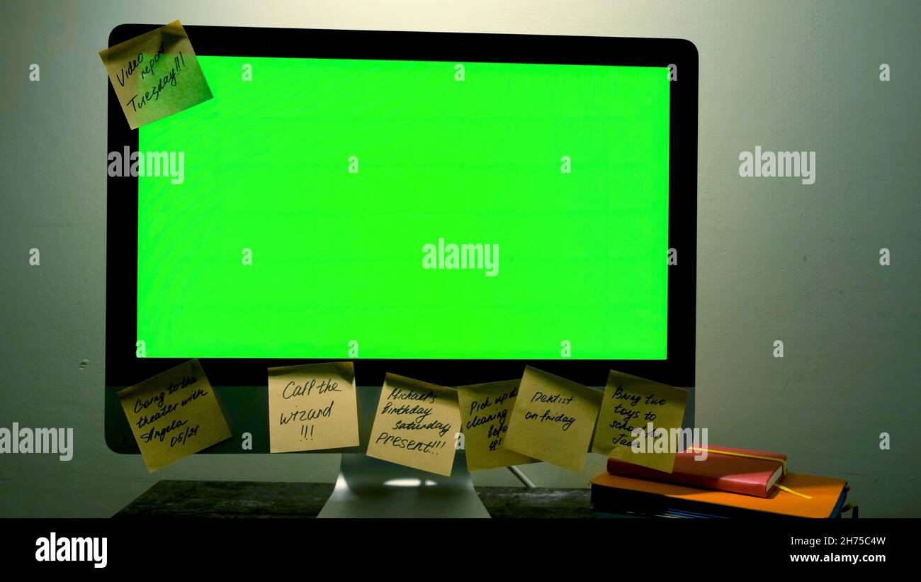 Green computer screen with notes. Concept. Computer with green screen is  pasted around edges with paper stickers with reminders and motivational  words Stock Photo - Alamy