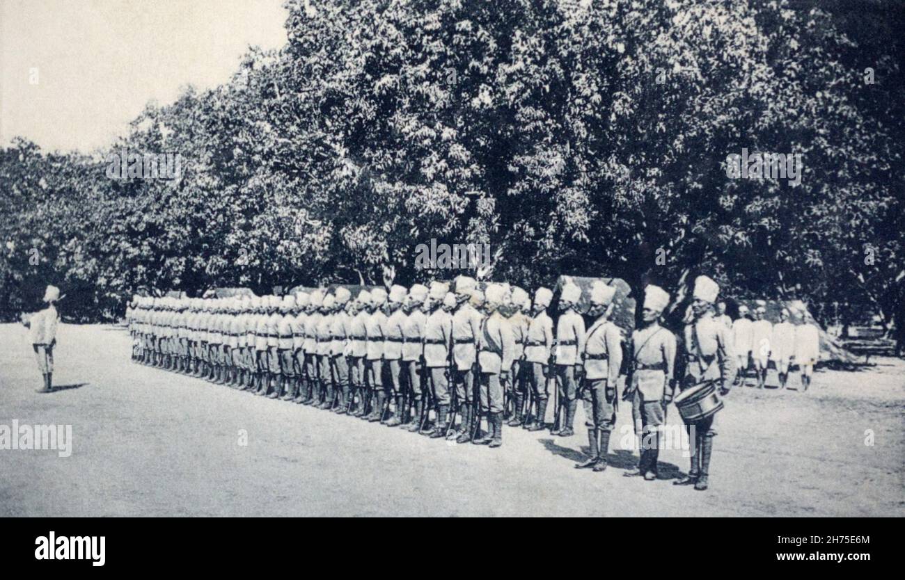 A historical view of a unit of British Colonial Indian Military Police on parade. Taken from a postcard c. 1912. Stock Photo