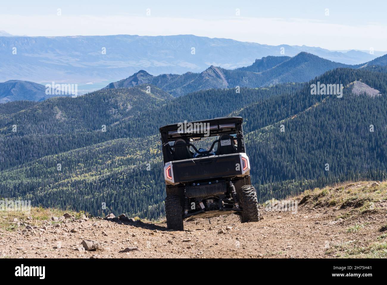 An offroad 4wheel drive utility allterrain vehicle on a dirt road in
