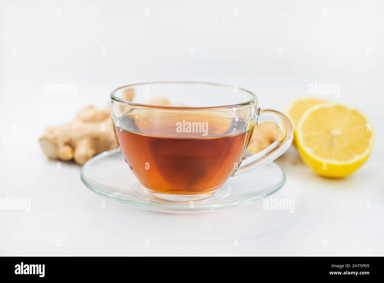 hot black drink tea in a cup with lemon and ginger Stock Photo Alamy
