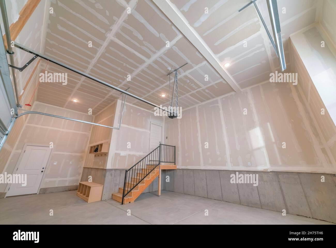 Empty garage interior with an automatic door operator Stock Photo
