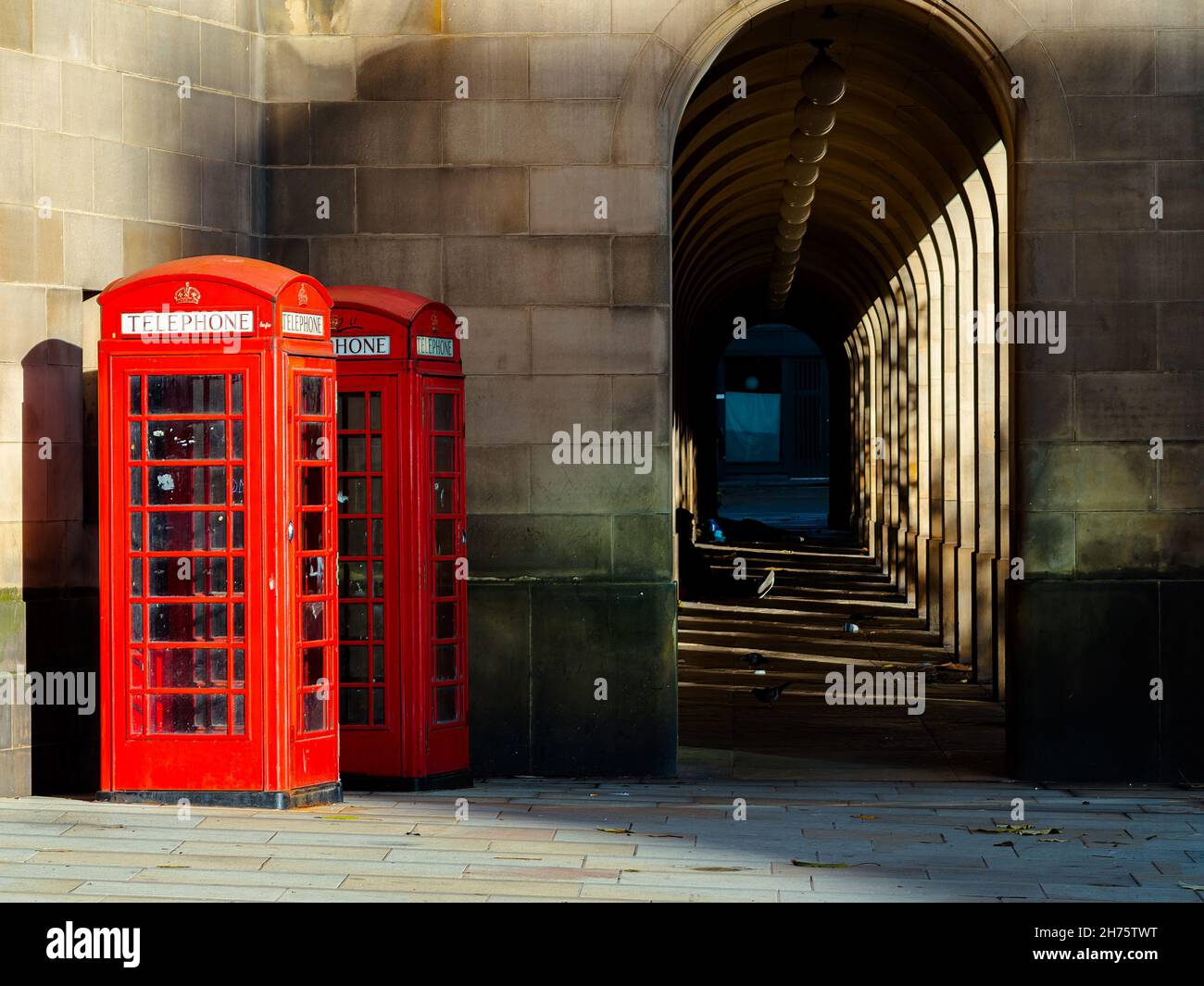 two red telephone boxes in the city Great Britain Stock Photo