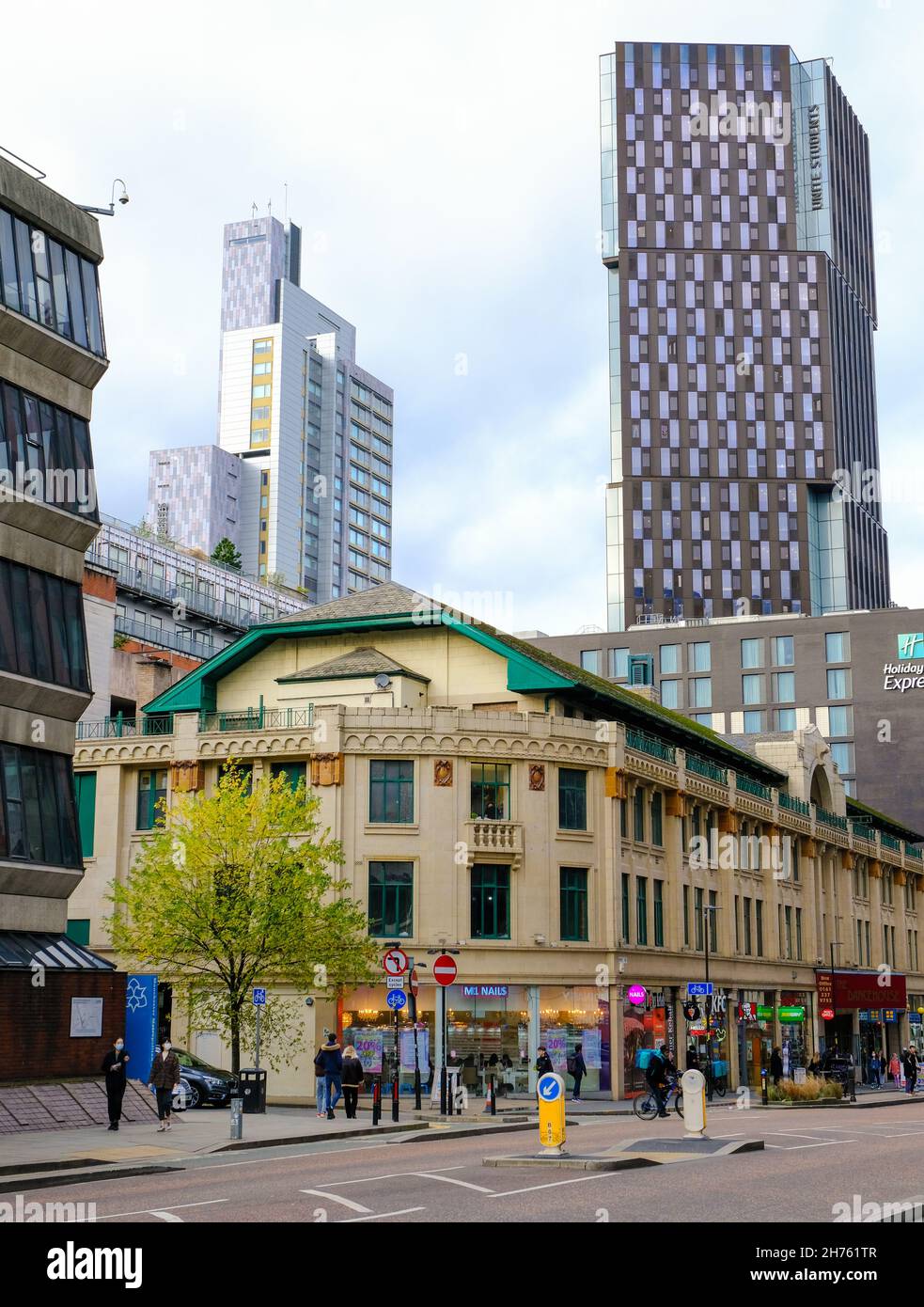 Contemporary architecture emerges around Victorian buildings in Manchester city centre. Stock Photo