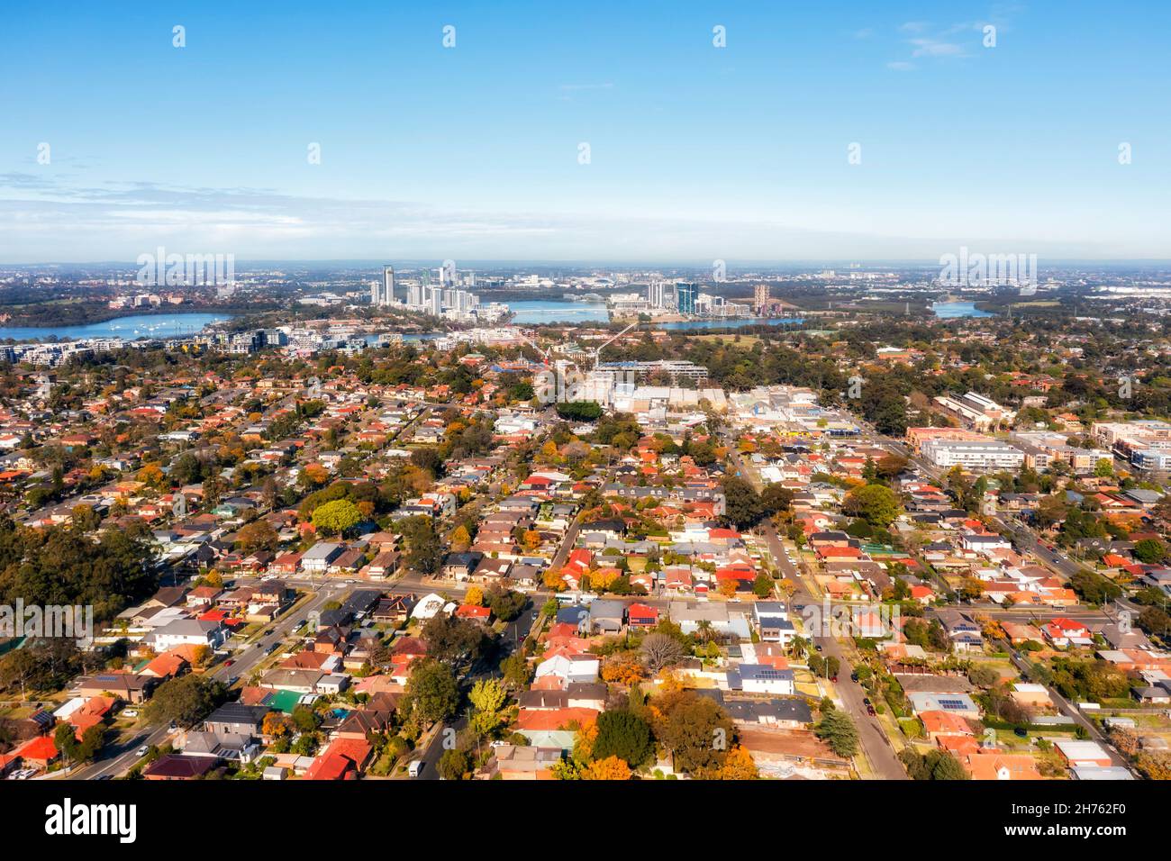 West Ryde on shores of Parramatta river with Meadowbank and Rhodes residential suburbs of Sydney West - aerial cityscape. Stock Photo
