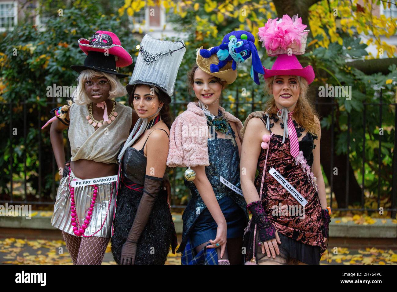 Models showcase Pierre Garroudi's latest colourful collection at one of the designer's specialty flash mob fashion show in Knightsbridge. (Photo by Pietro Recchia / SOPA Images/Sipa USA) Stock Photo