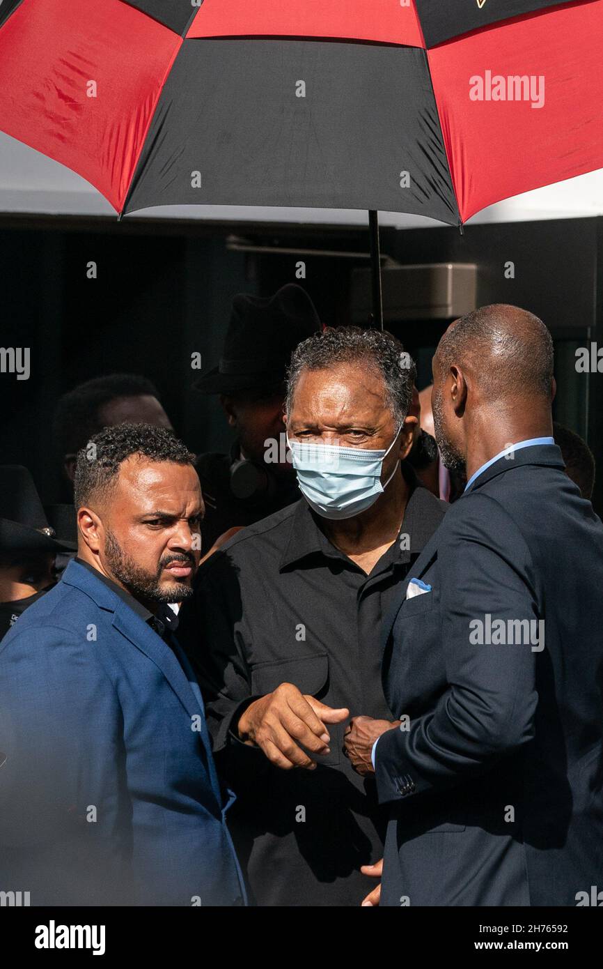 Rev. Jesse Jackson, center, is escorted through the crowd during the Wall of Prayer event in support of justice for Ahmaud Arbery outside the Glynn County Courthouse November 18, 2021 in Brunswick, Georgia. The trial of defendants Greg McMichael, Travis McMichael, and a neighbor, William 'Roddie' Bryan continued inside the courthouse. Stock Photo