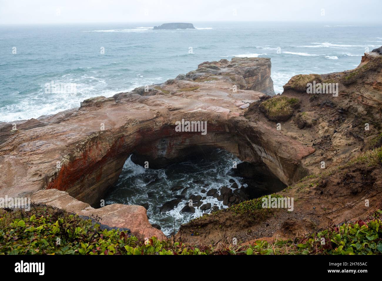 Devils punchbowl at Otter Rock Oregon Stock Photo