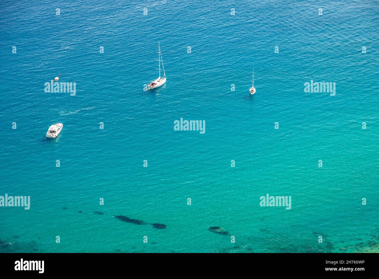 Crystal clear sea water bay. Pristine ocean lagoon sunny cloudy