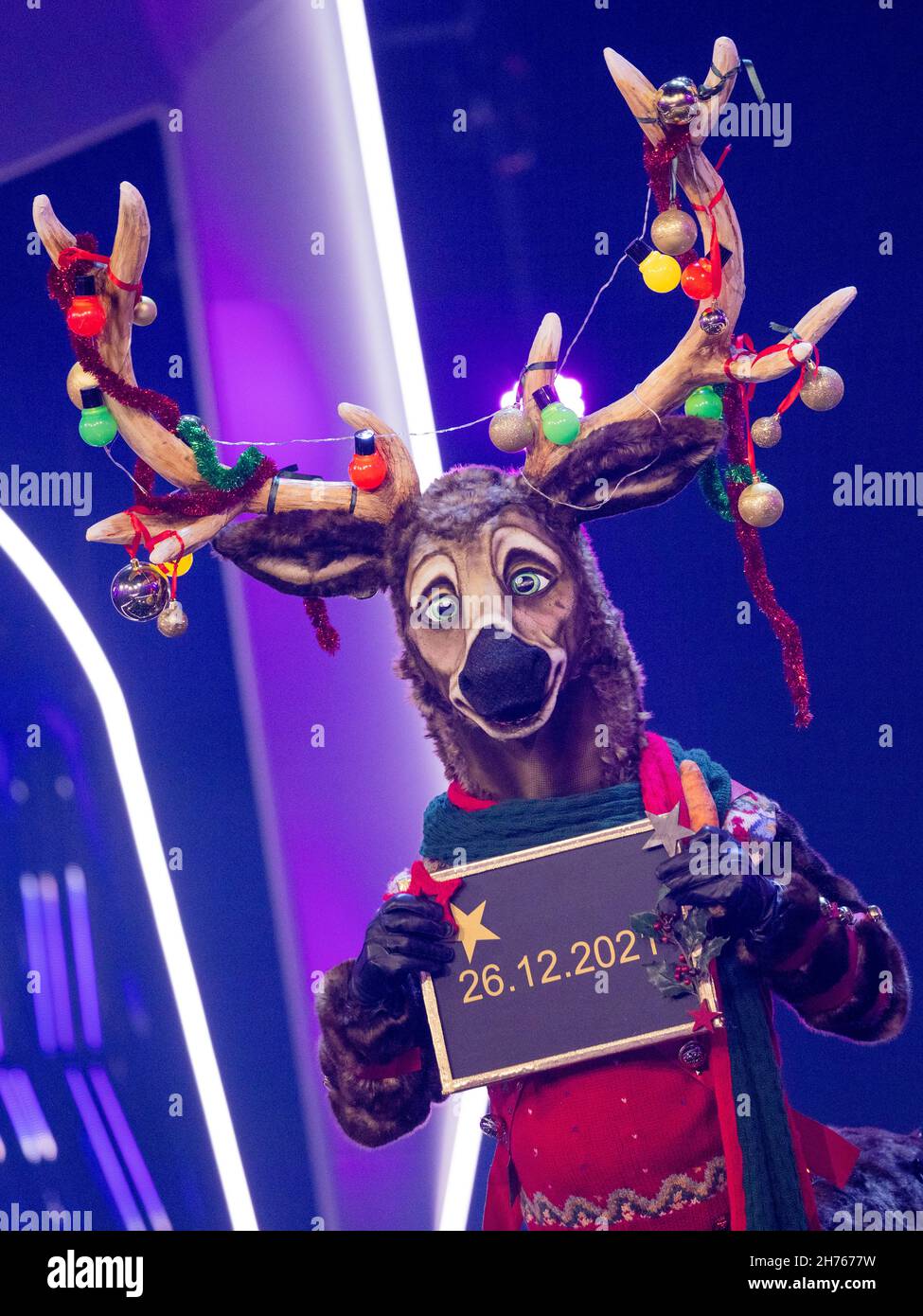 Cologne, Germany. 20th Nov, 2021. A reindeer figure points out a special show on stage in the Prosieben show "The Masked Singer". Credit: Rolf Vennenbernd/dpa/Alamy Live News Stock Photo