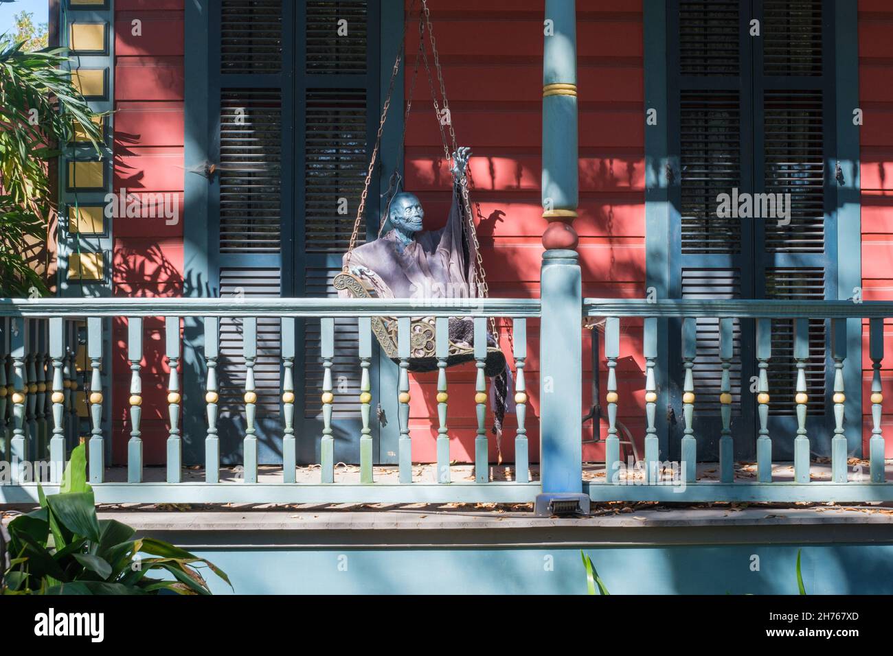 NEW ORLEANS, LA, USA NOVEMBER 16, 2021 Scary Halloween creature on porch swing of colorful