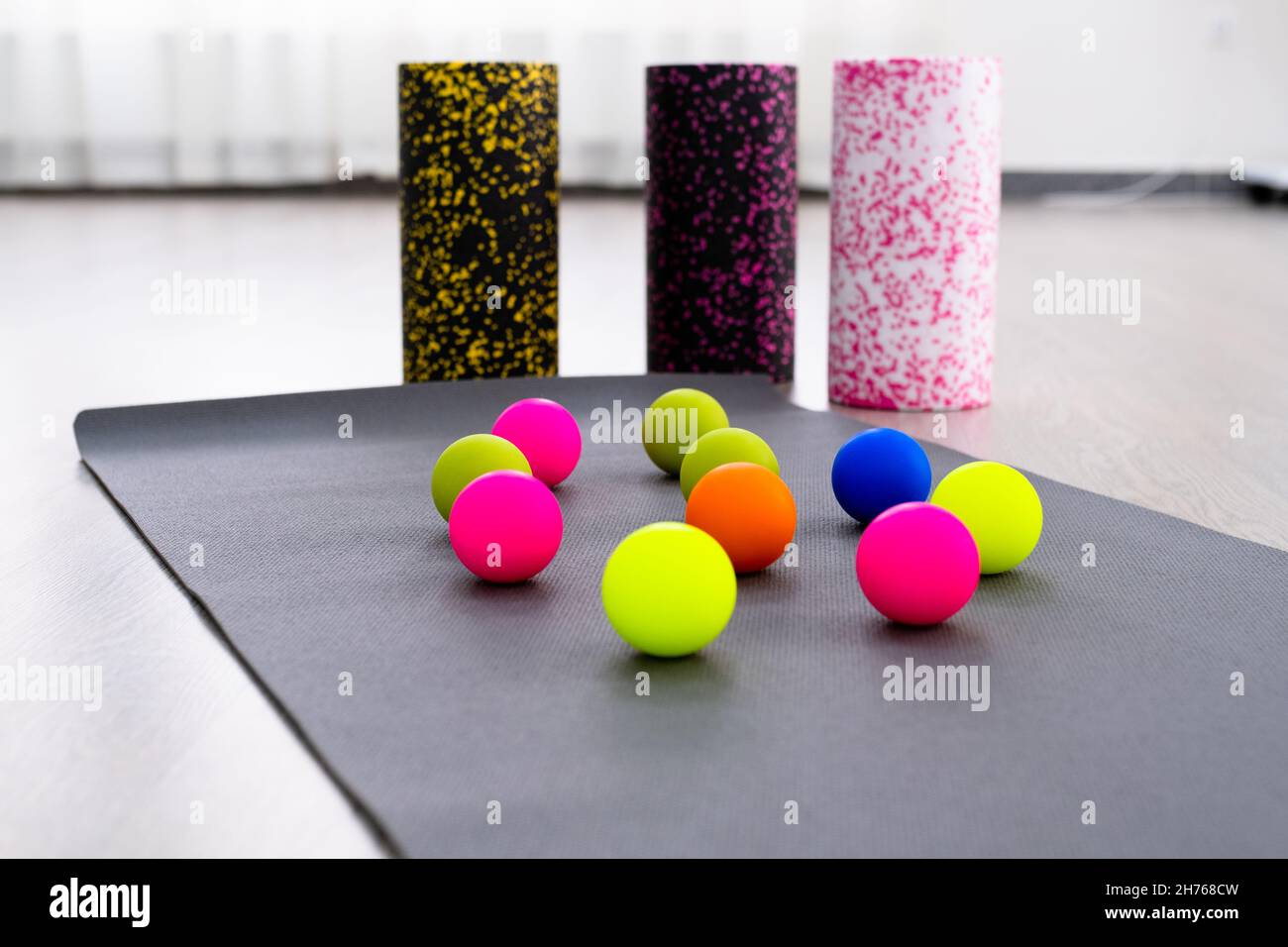 Colored Myofascial release massage balls, roll and other body roll recover on gray mat Stock
