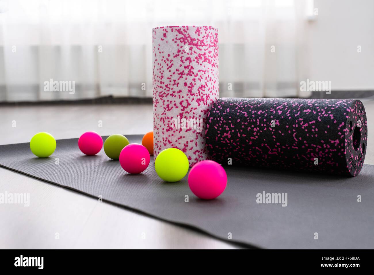 Colored Myofascial release massage balls, roll and other body roll recover on gray mat Stock