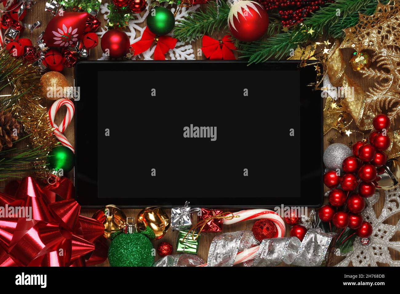 Blank tablet surrounded with Christmas decorations Stock Photo