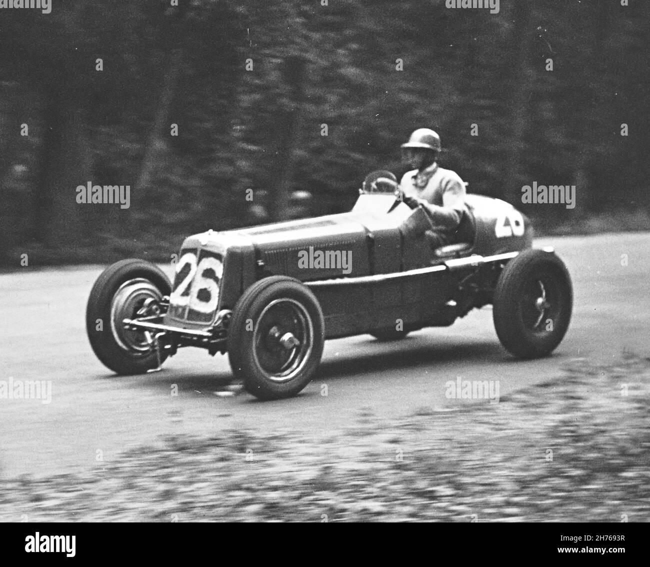 A P R (Tony) Rolt Coronation Races 14th May 1938, where he drove car #26, 1500cc  supercharged ERA R5B to two wins. this is the ex B Bira car  and still being raced today and one of the must successful racing cars ever, always known as 'Remus' and still painted in Bira's colours, of pale blue and yellow, the race colours of Siam (now Thailand), but during Rolt's ownership, it was painted grey. Stock Photo
