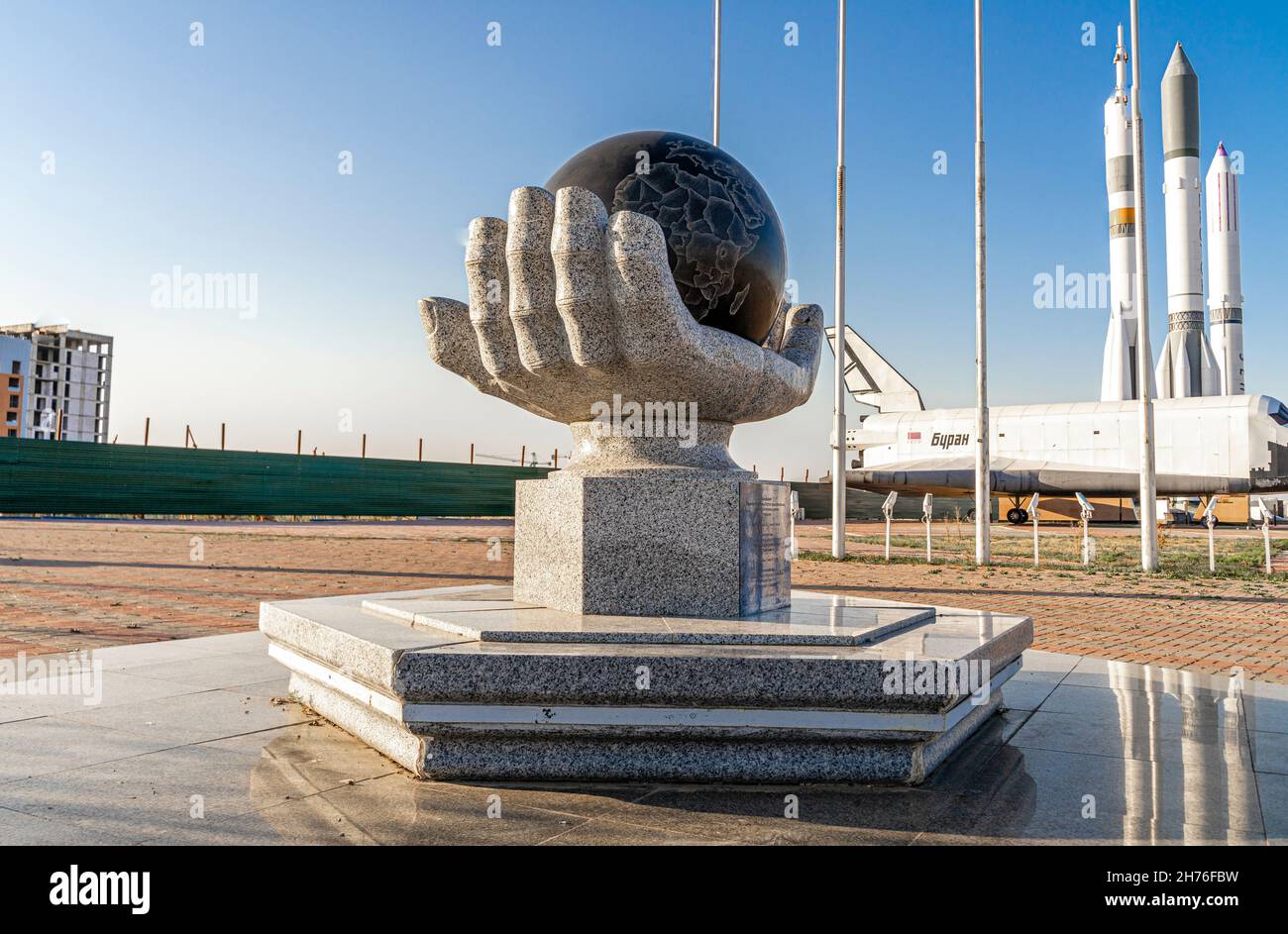 Hand holding Globe- concept conceptual sculpture, symbolizing space exploration and research. National Space Center in Astana, Nur-Sultan, Kazakhstan Stock Photo