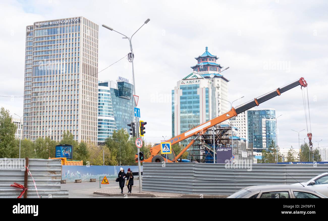 Construction works at real estate development complex Abu-Dabi plaza in Nur-Sultan, Kazakhstan. View of major buildings in downtown Astana Stock Photo