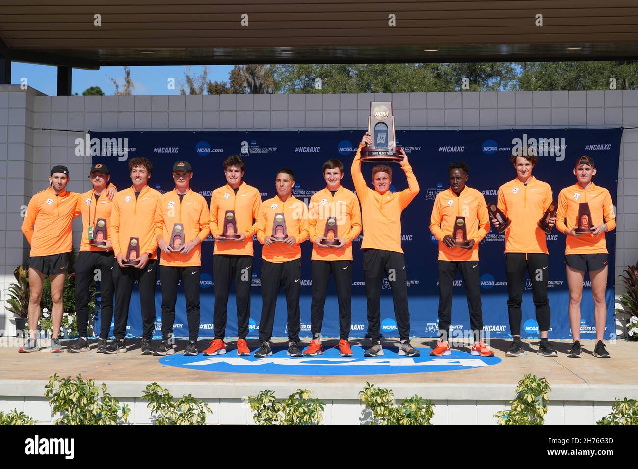 The Oklahoma State Cowboys men's team and coach Dave Smith pose with