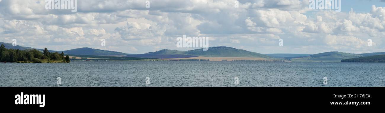 Panorama of the Big Lake on a summer cloudy day. Sharypovsky district. Krasnoyarsk region. Russia. Stock Photo